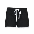Skinnifit's SK069 features black athletic shorts with white trim and a drawstring waistband.