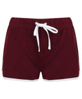 A pair of Skinnifit SK069 maroon athletic shorts featuring a white drawstring and white trim along the sides and hem.