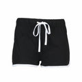 The SM069 by Skinnifit are black athletic shorts featuring a white drawstring and trim, displayed against a white background.