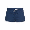 The Skinnifit SM069 shorts are a pair of dark blue athletic shorts featuring a white drawstring and white trim along the edges. They come with an elastic waistband and seem to be crafted from a lightweight material.