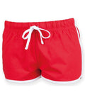 The Skinnifit SM069 athletic shorts are red with a white drawstring and white trim along the edges. Designed for comfort, they feature an elastic waistband.