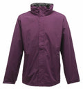 Displayed against a white background, the Regatta Professional SN100 is a purple waterproof jacket featuring a high collar and full-length sleeves. It comes equipped with a front zipper that is concealed by a flap.