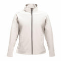 The SN131 by Regatta Professional is a light beige jacket featuring a high collar and front zipper. It includes two side pockets and offers a casual fit. The material has a smooth texture, resulting in a simple and versatile overall style.
