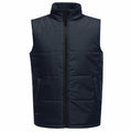 The SN133 by Regatta Professional is a black sleeveless puffer vest featuring a front zipper and two side pockets.