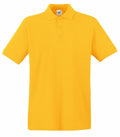 A Fruit of the Loom SS255 polo shirt, featuring a vibrant yellow color, is displayed against a plain white background. This shirt is designed with short sleeves, a collar, and a three-button placket.