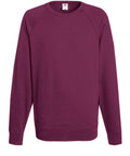 A plain maroon crew neck sweatshirt from Fruit of the Loom, model SS970, features long sleeves and is displayed on a white background. It boasts a simple, comfortable design with ribbed cuffs and hem, making it suitable for casual wear.