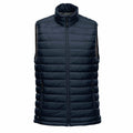 The ST015 by Stormtech is a black quilted puffer vest, featuring a sleeveless design, full front zipper, and high collar.