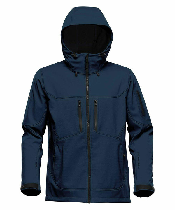 A navy blue Stormtech ST017 with front zippers and multiple pockets, including chest and sleeve pockets. The jacket is designed with a modern fit and features drawstrings on the hood.