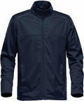 The ST075 by Stormtech is a navy blue zip-up jacket with a high collar. It boasts long sleeves, side pockets with zippers, and a simple, sleek design.