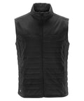 The ST174 by Stormtech is a black, quilted puffer vest featuring a sleeveless design, front zipper, and stand-up collar.