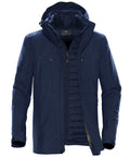 Introducing the Stormtech ST179: a stylish navy blue, multi-layered jacket. This jacket features a hood and a zippered front, complemented by multiple zippered pockets and a padded inner layer that makes it perfect for cold weather conditions.