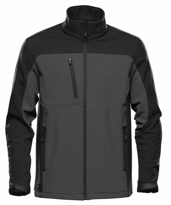 A black and grey zip-up jacket with a high collar, featuring two side pockets and one chest pocket with zippers, called the ST197 by Stormtech.