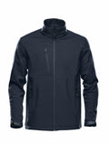 The Stormtech ST197 is a navy blue softshell jacket featuring a high collar, front zipper, and three zippered pockets.