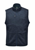 The Stormtech ST206 is a navy blue zip-up fleece vest featuring a high collar and three zippered pockets.
