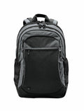 The Stormtech ST220 gray backpack, featuring multiple zippered compartments and adjustable shoulder straps, is displayed against a plain white background.