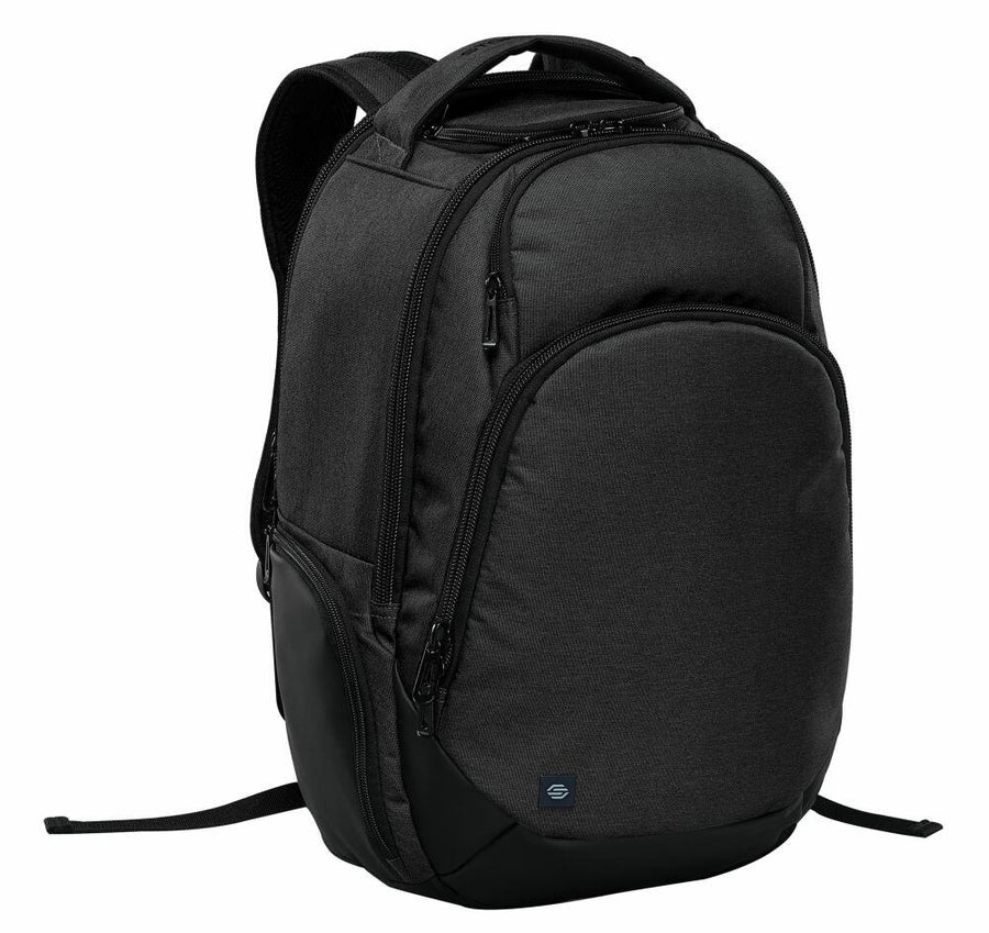 A black ST221 backpack by Stormtech features multiple compartments, padded shoulder straps, and a small logo on the front pocket.