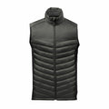 ST223 by Stormtech is a sleeveless, green quilted jacket that features a high collar and front zipper closure.