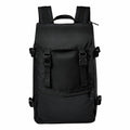 Introducing the Stormtech ST234: a sleek black backpack featuring two adjustable shoulder straps, a convenient top handle, and a front pocket secured with a zipper.