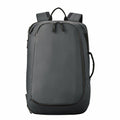 Introducing the Stormtech ST235: a sleek dark gray backpack featuring two main zippers, adjustable shoulder straps, and a convenient side handle.