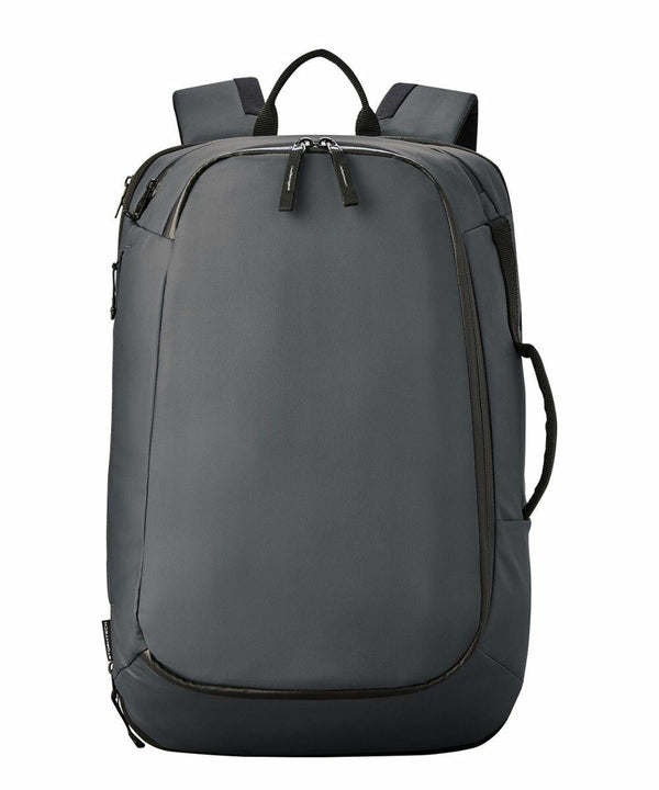 A gray Stormtech ST235 backpack with multiple zippered compartments, padded shoulder straps, and a side handle, shown against a white background.