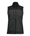 The Gilets & Body Warmers is a black sleeveless gilet with a high collar, full front zip, and three zipped pockets—one on the chest and two on the sides—displayed against a white background.