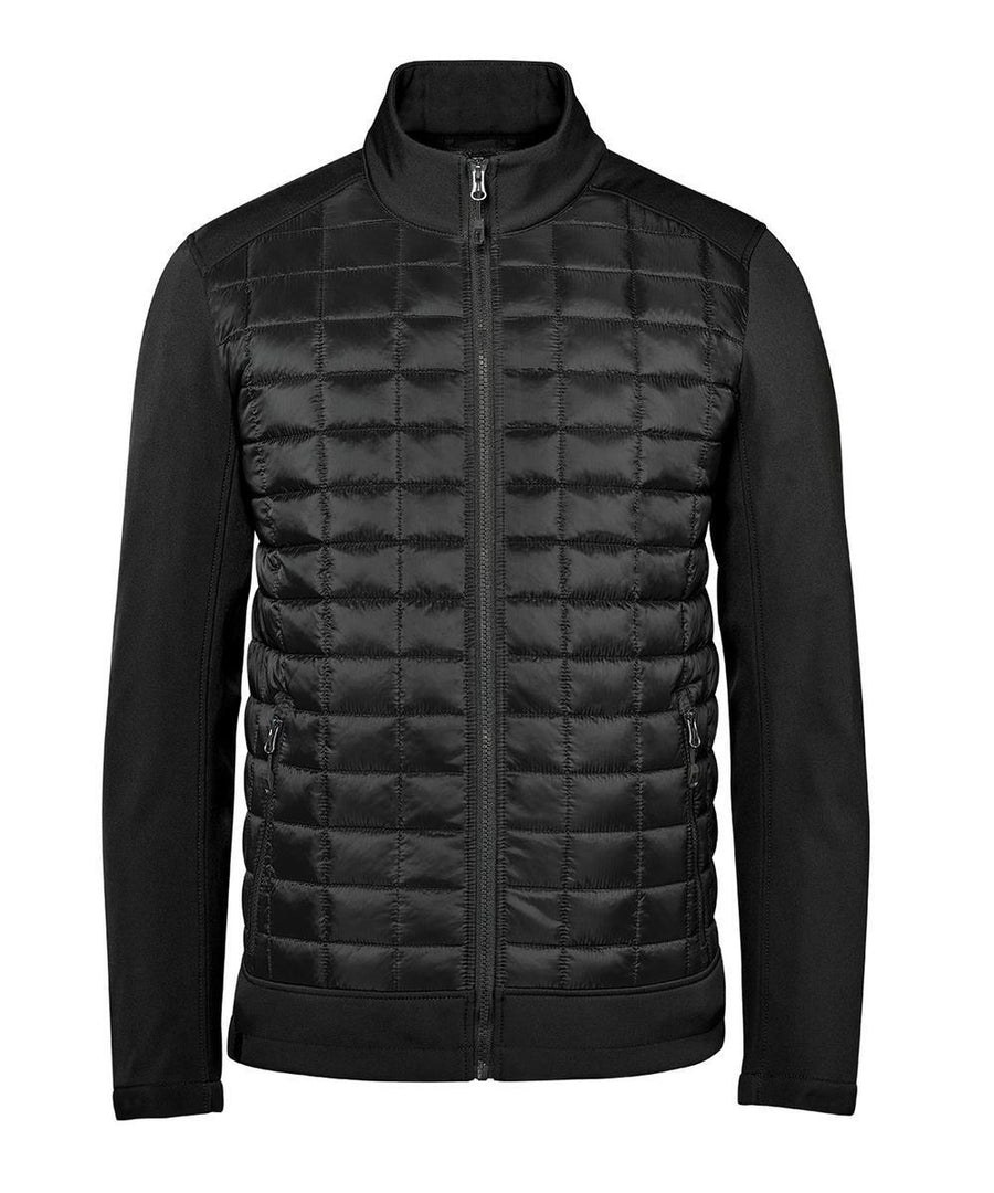 The Softshells jacket features a black, full-zip design with a quilted front, smooth sleeves and sides, zipped pockets, and a stand-up collar, shown against a white background.