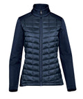 The Softshells jacket features a navy blue, long-sleeve design with quilted, padded body, smooth fabric on sleeves and shoulders, a full front zip, and high collar.