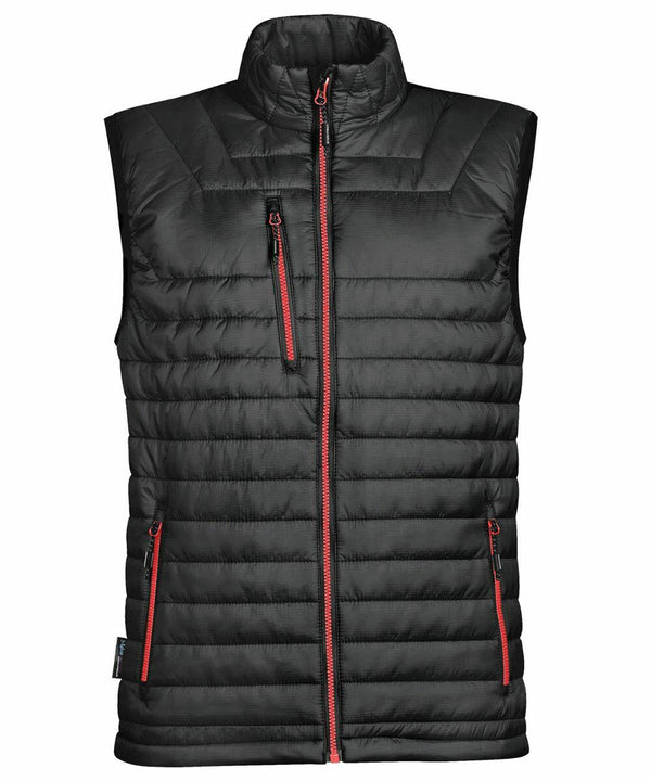 Stormtech ST805 black puffer vest with red zippers, standing collar, and multiple pockets, shown against a white background.
