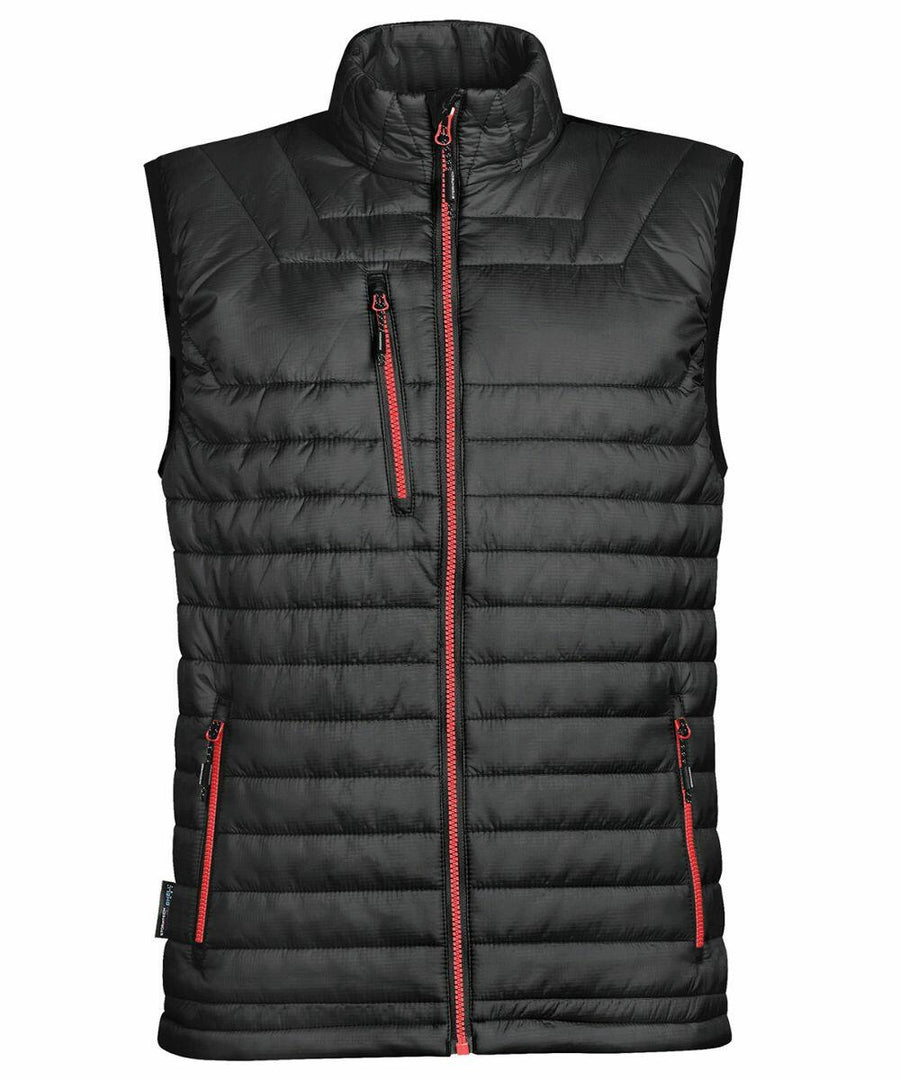Stormtech ST805 black puffer vest with red zippers, standing collar, and multiple pockets, shown against a white background.