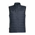 The Stormtech ST805 is a sleeveless puffer vest in dark gray, featuring a front zipper and three zippered pockets, showcased against a plain white background.