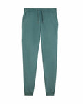 Introducing the SX100 by Stanley/Stella: These teal jogger sweatpants feature an elastic waistband with a drawstring, two side pockets, and tapered legs for a stylish fit.