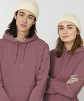 Two individuals wearing Stanley/Stella SX147 knit hats and mauve hoodies stand side by side against a plain background.