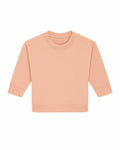 The Stanley/Stella SX187 is a soft peach-colored, long-sleeved sweatshirt showcased against a white backdrop. It features a simple round neckline and ribbed cuffs.