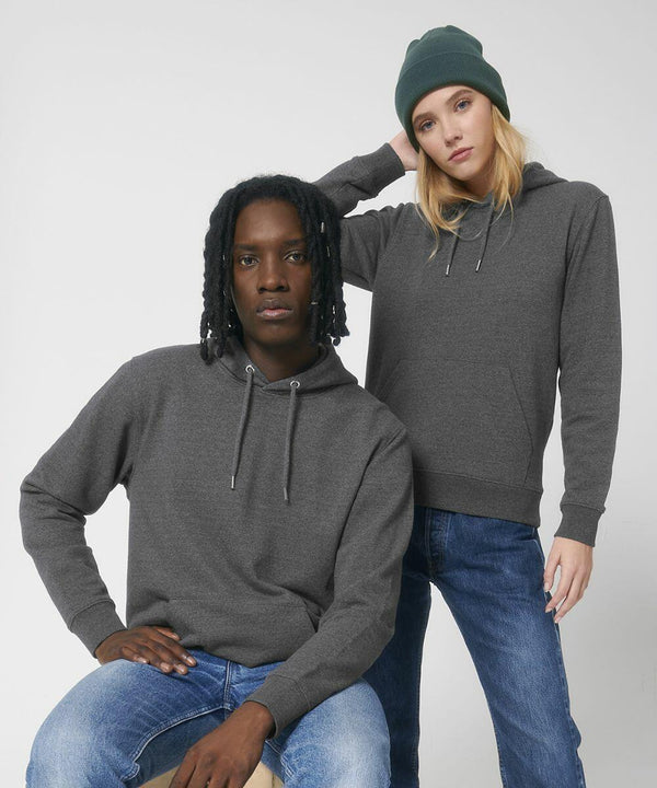 Two people dressed in gray hoodies and blue jeans pose against a plain background. One person is sitting while the other is standing, wearing a green beanie by Stanley/Stella SX219.