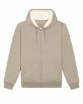 The SX222 by Stanley/Stella is a beige zip-up hoodie that boasts a cozy white fleece lining. It features a hood with drawstrings and front pockets, beautifully displayed laid flat against a white backdrop.