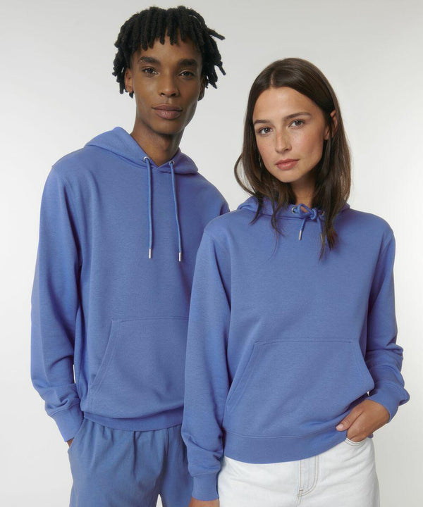 A person with short hair and a person with long hair are both wearing blue Stanley/Stella SX225 hoodies and standing against a plain background.