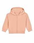 Introducing the SX229 by Stanley/Stella: a delightful peach-colored children's hoodie featuring a front zipper, long sleeves, and an attached hood. Crafted from soft fabric for ultimate comfort, it is showcased against a simple white background.