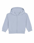 The SX229 by Stanley/Stella is a light blue hooded sweatshirt featuring a front zipper. It comes with long sleeves and has ribbed cuffs and hem, displayed against a white background.