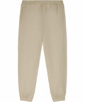 Stanley/Stella SX242 sweatpants in beige, featuring a drawstring, elastic cuffs, and side pockets.