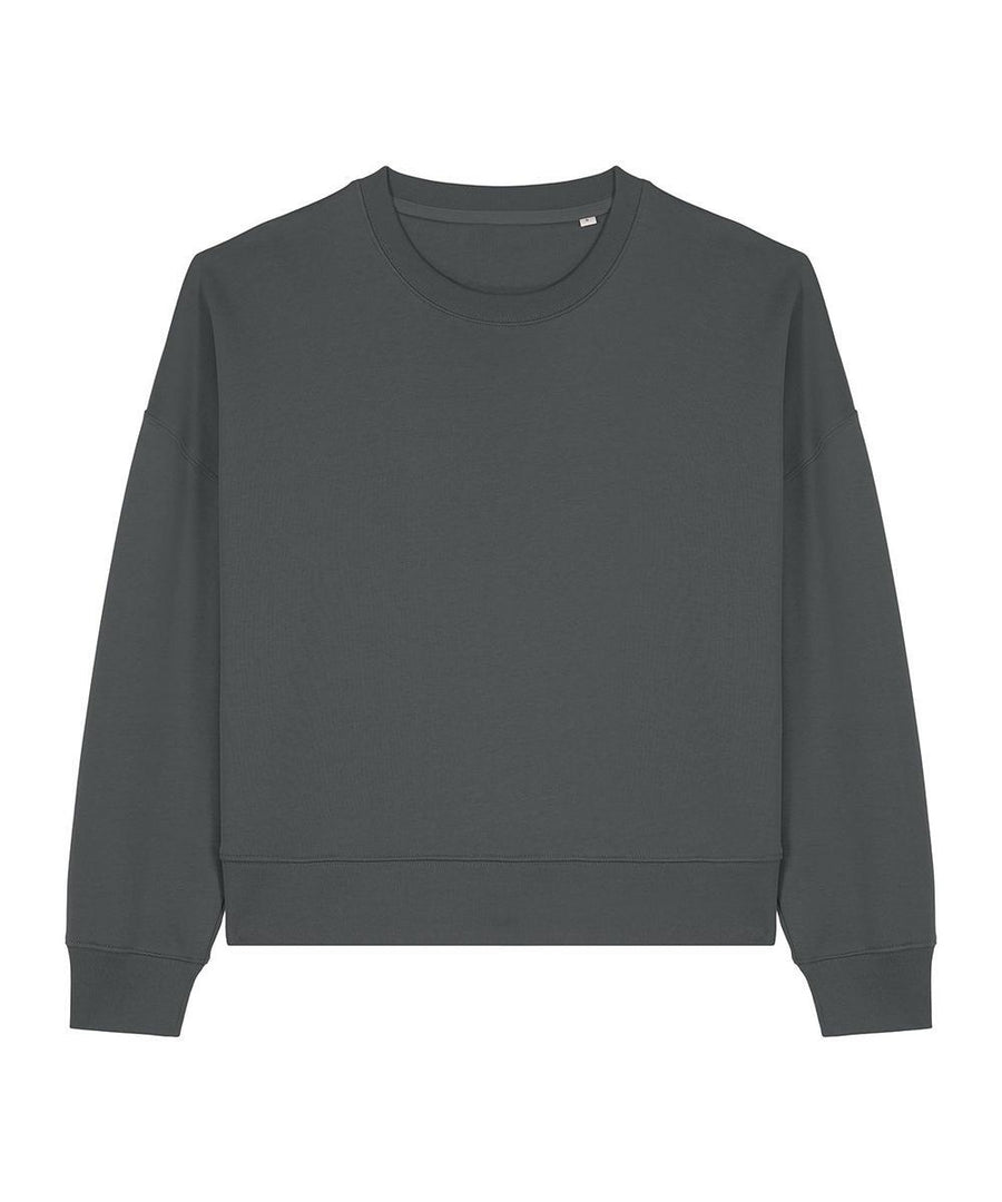 A plain, long-sleeved dark grey sweatshirt crew neck is laid flat on a white background, featuring ribbed cuffs and hem with no visible logos or designs.