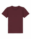 The SX702 by Stanley/Stella is a plain, dark red t-shirt featuring short sleeves and a round neckline, displayed laid flat against a white background.