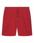 The SX722 shorts by Stanley/Stella feature a vibrant red hue, an elastic waistband with a drawstring, and two convenient side pockets, all elegantly displayed against a white background.