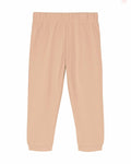The Stanley/Stella SX767 sweatpants in beige feature an elastic waistband and cuffs, presented against a white backdrop.