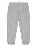 SX767 sweatpants by Stanley/Stella are shown laid flat, featuring a gray color with an elastic waistband and cuffs. The soft fabric suggests comfort and the design is simple and casual.