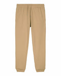 A pair of Stanley/Stella SX773 beige jogger pants featuring an elastic waistband and drawstring. The pants come with ribbed cuffs and are displayed on a plain white background.