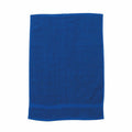 A vibrant blue Towel City towel (product code: TC002) is laid out flat. It appears soft and plush, with subtle texture variations, and the edges are neatly finished.