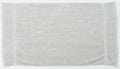 A plain white TC003 towel from Towel City is spread out flat against a light background, showcasing its simple texture with two vertical seams near the edges.