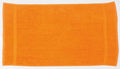 A bright orange rectangular towel from Towel City, product TC003, is laid flat on a white background. It features a smooth texture and two slightly darker vertical lines near the edges that add visual detail.