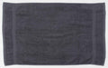 A dark gray rectangular towel from Towel City, product name TC003, is laid flat. It features a soft texture with two vertical stripe accents near its edges.