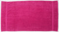 A Towel City product, model TC004, features a bright pink rectangular design with two slightly darker border stripes along its short edges and is laid flat on a white surface.
